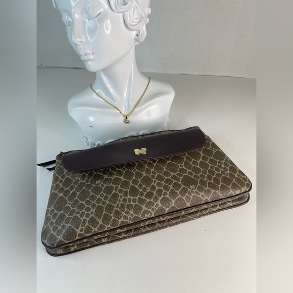 Nina Ricci Handbags - Nina Ricci Bundle (Wristlet and necklace)